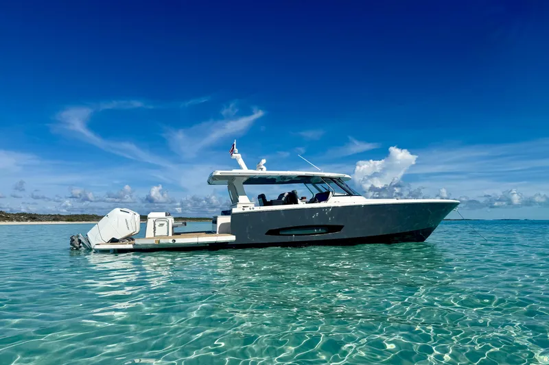 Slide: The Image of 2026 Regal 50 SAV yacht on clear turquoise water under a vibrant blue sky. - 6