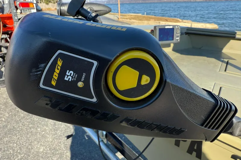 Slide: The Image of Close-up of a 2014 Lowe Roughneck 1650 DLX boat motor control. - 18