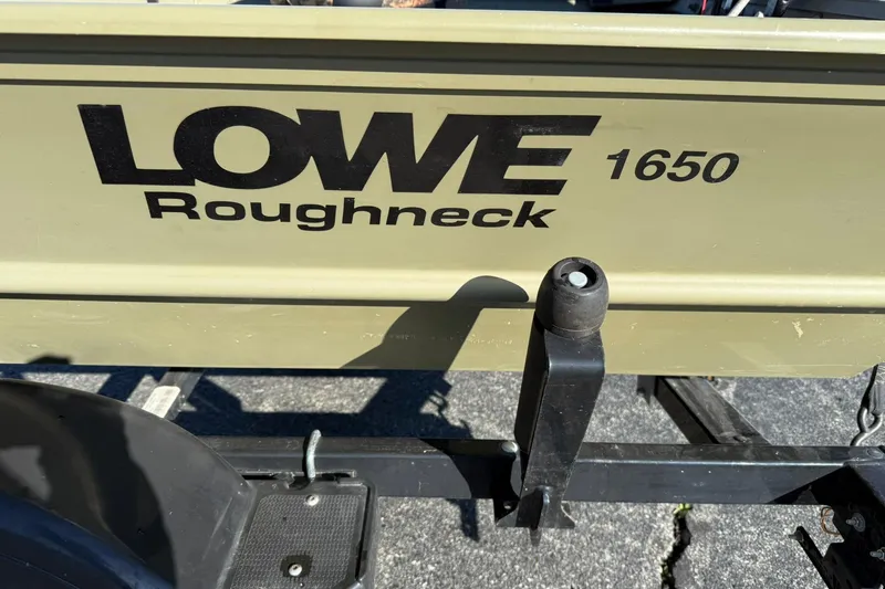 Slide: The Image of 2014 Lowe Roughneck 1650 DLX boat on trailer, close-up view. - 3