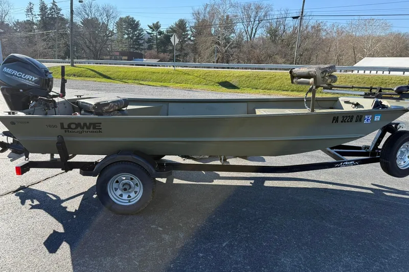 Slide: The Image of 2014 Lowe Roughneck 1650 DLX boat on trailer with Mercury outboard motor. - 8
