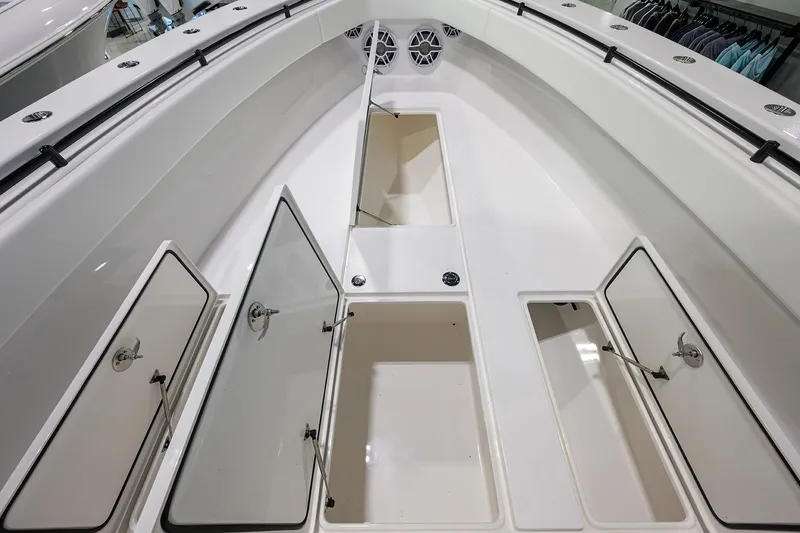 Slide: The Image of 2026 Contender 39 ST boat interior with open storage compartments and sleek design. - 11