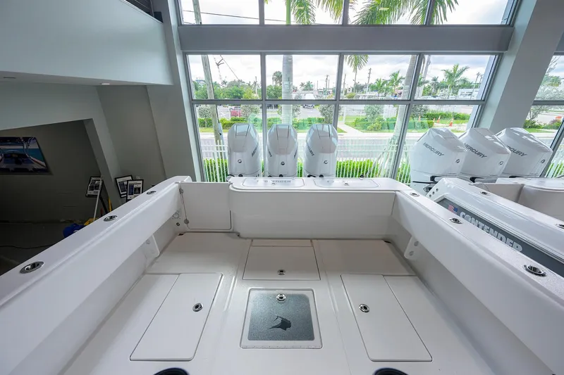 Slide: The Image of 2026 Contender 39 ST boat interior with multiple Mercury outboard engines. - 15