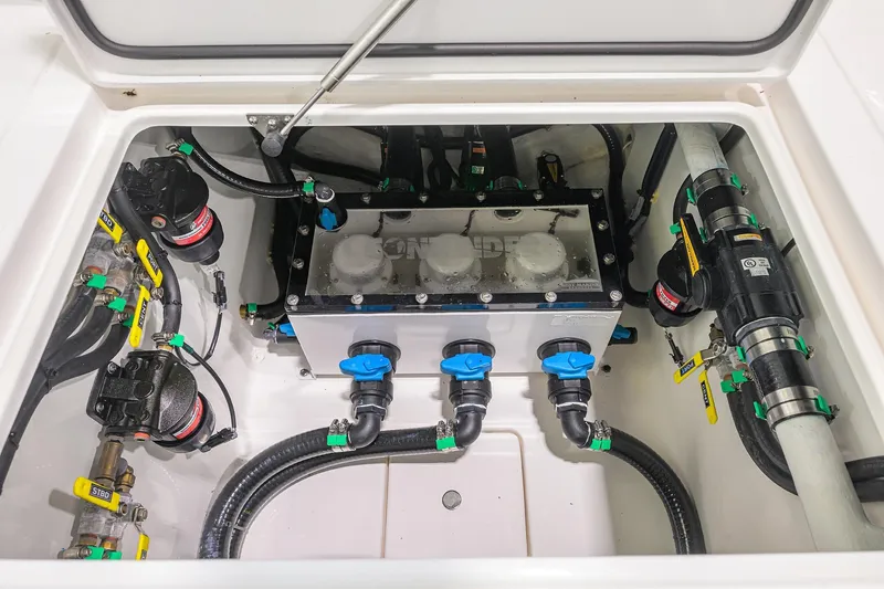 Slide: The Image of Engine compartment of 2026 Contender 39 ST boat, showcasing advanced plumbing and filtration systems. - 27