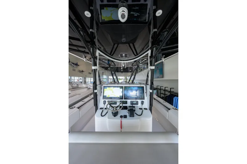 Slide: The Image of 2026 Contender 39 ST boat cockpit with advanced navigation displays and controls. - 6