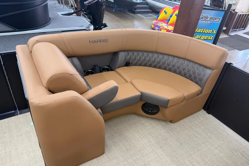 Slide: The Image of 2026 Harris Cruiser 210 boat interior with tan leather seating and cup holders. - 10