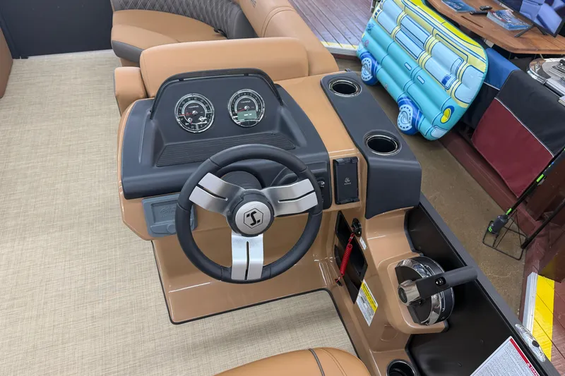 Slide: The Image of 2026 Harris Cruiser 210 boat dashboard with steering wheel and gauges. - 6