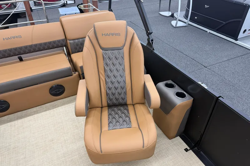 Slide: The Image of Luxurious seating on 2026 Harris Cruiser 210 boat with tan and gray upholstery. - 8
