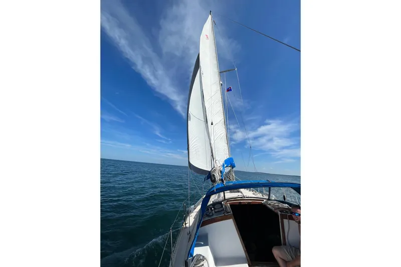 Slide: The Image of Sailing on a 1985 Catalina 36 yacht under clear blue skies. - 10