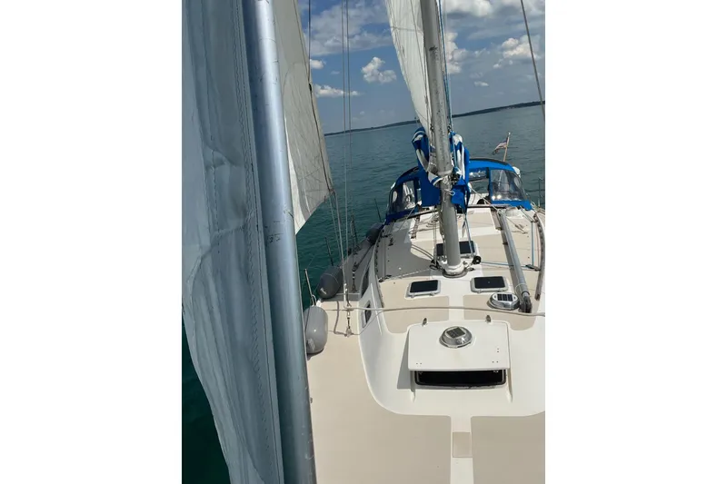Slide: The Image of Sailing on a 1985 Catalina 36 yacht with clear skies and calm waters. - 3