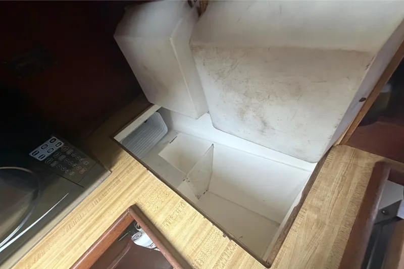Slide: The Image of Interior of a 1985 Catalina 36 with refrigerator. - 32