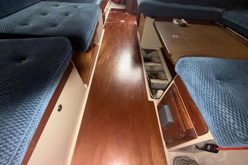 Slide: The Image of Interior of a 1985 Catalina 36 yacht with blue upholstery. - 39