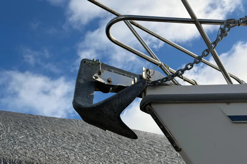 Slide: The Image of Anchor and chain on 1985 Catalina 36 sailboat against blue sky. - 45