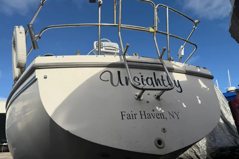 Slide: The Image of Catalina 36 sailboat from 1985, named "Unsightly," docked in Fair Haven, NY. - 52