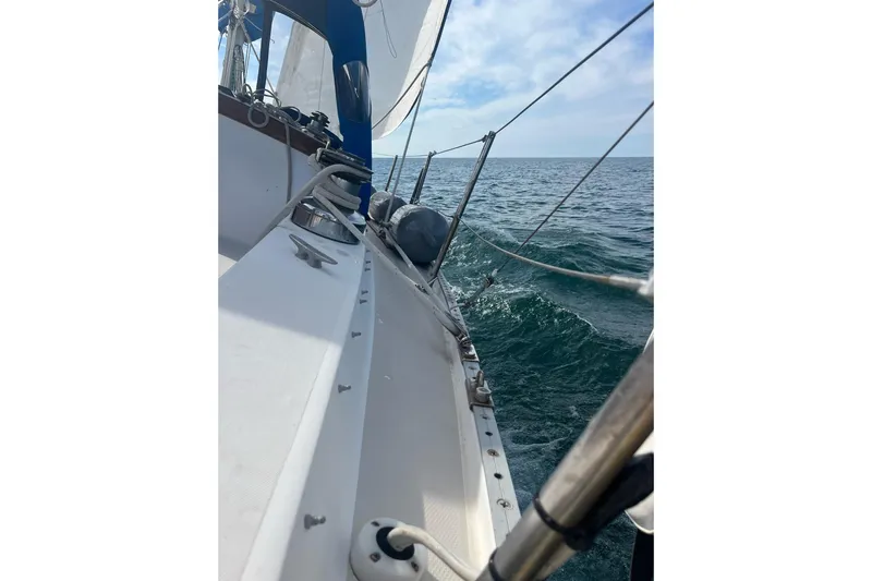 Slide: The Image of Sailing on a 1985 Catalina 36 yacht, ocean view with clear skies. - 9