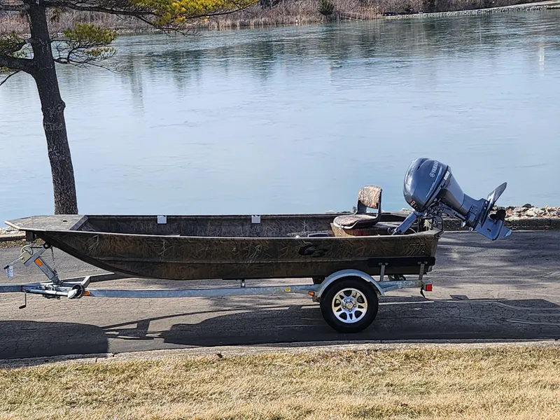 The Image of 2019 G3 Gator Tough 15 DK boat on trailer by a lake. - 0