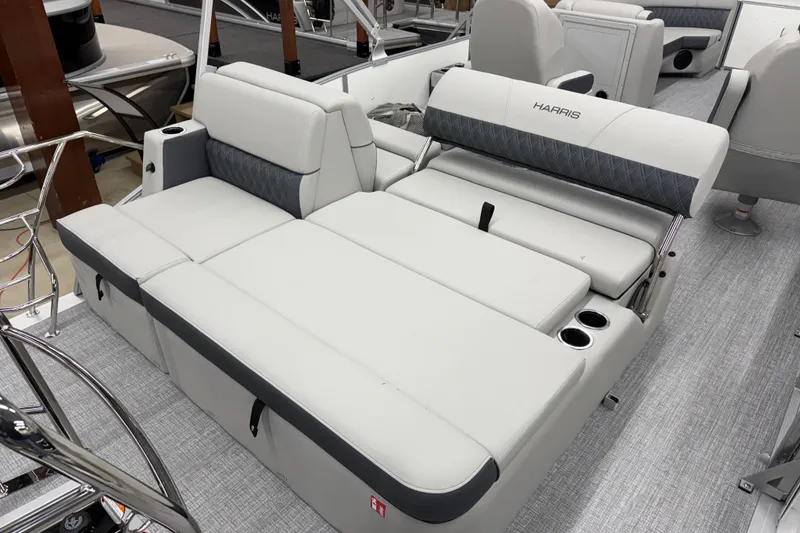 Slide: The Image of 2026 Harris Cruiser 230 boat interior with luxurious seating and cup holders. - 10