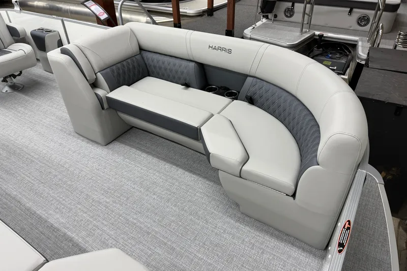 Slide: The Image of 2026 Harris Cruiser 230 boat interior with plush seating and cup holders. - 3