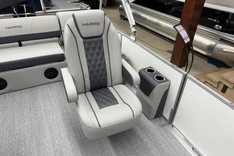 Slide: The Image of 2026 Harris Cruiser 230 boat interior with luxurious seating and cup holders. - 5