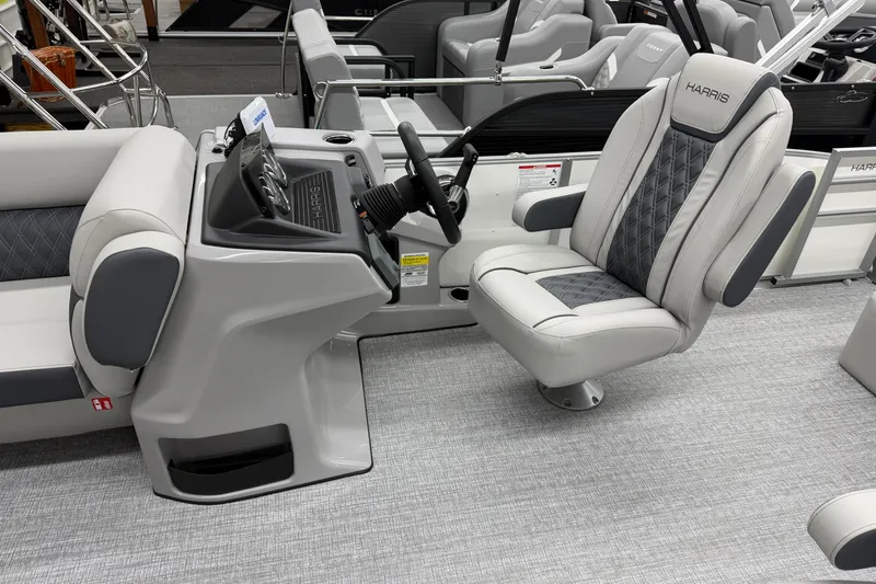 Slide: The Image of 2026 Harris Cruiser 230 boat interior with modern helm and luxurious seating. - 6