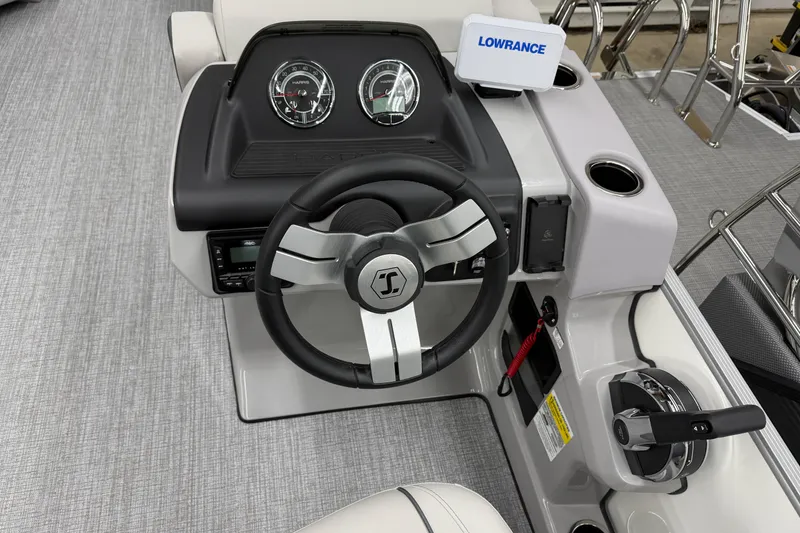 Slide: The Image of Steering console of 2026 Harris Cruiser 230 with gauges and controls. - 7