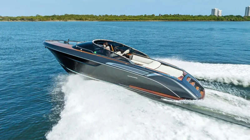 Slide: The Image of 2017 Riva Rivamare luxury speedboat cruising on open water. - 1
