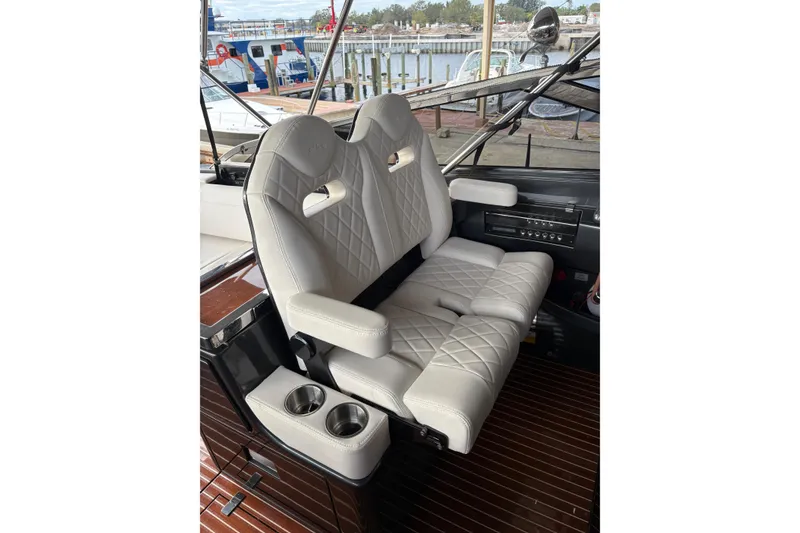 Slide: The Image of Luxurious seating on 2017 Riva 38' Rivamare yacht with quilted leather and cup holders. - 13
