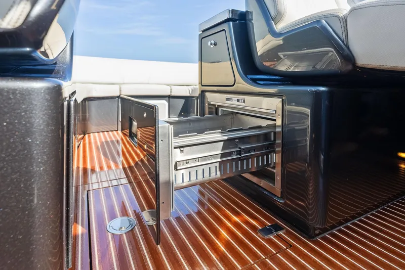 Slide: The Image of Open storage drawer on 2017 Riva Rivamare yacht with sleek wooden flooring. - 14