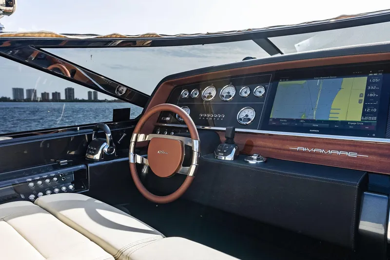 Slide: The Image of Interior cockpit of 2017 Riva Rivamare yacht with navigation system and leather steering wheel. - 16