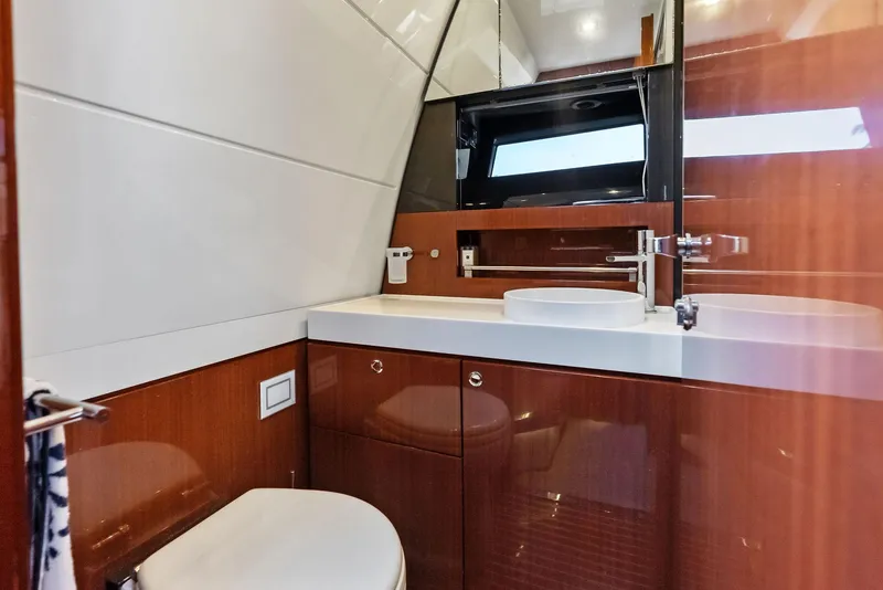 Slide: The Image of Luxurious bathroom interior of 2017 Riva Rivamare yacht with modern fixtures and wooden cabinetry. - 23