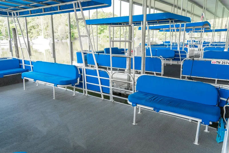 Slide: The Image of Spacious pontoon rental fleet with blue seating, custom design, 2000 model. - 19
