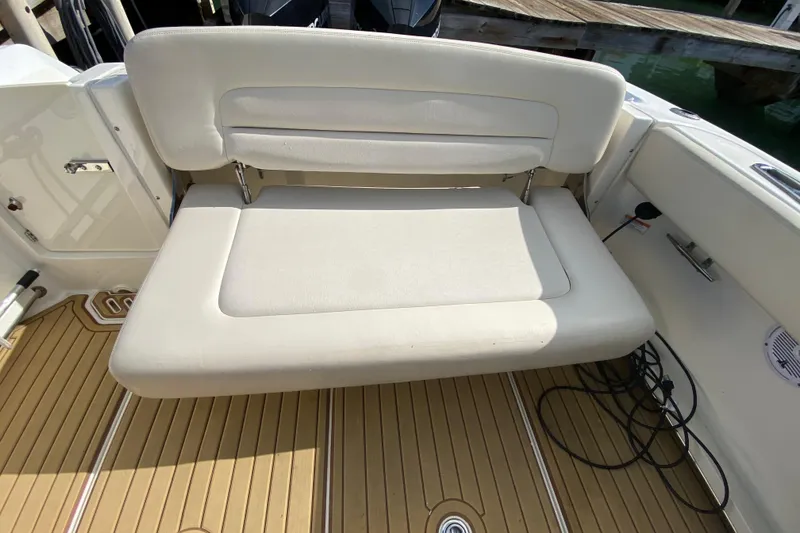 Slide: The Image of 2019 Boston Whaler 270 Vantage boat with foldable seating and teak flooring. - 37