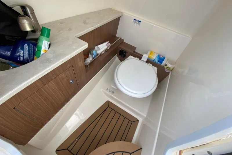 Slide: The Image of 2019 Boston Whaler 270 Vantage boat bathroom with sink, toilet, and storage. - 38