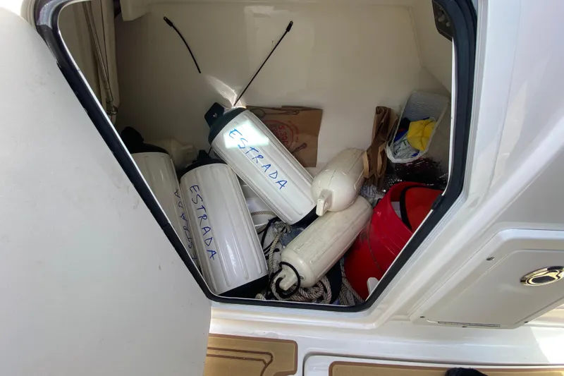 Slide: The Image of Storage compartment of 2019 Boston Whaler 270 Vantage with boat fenders and equipment. - 40