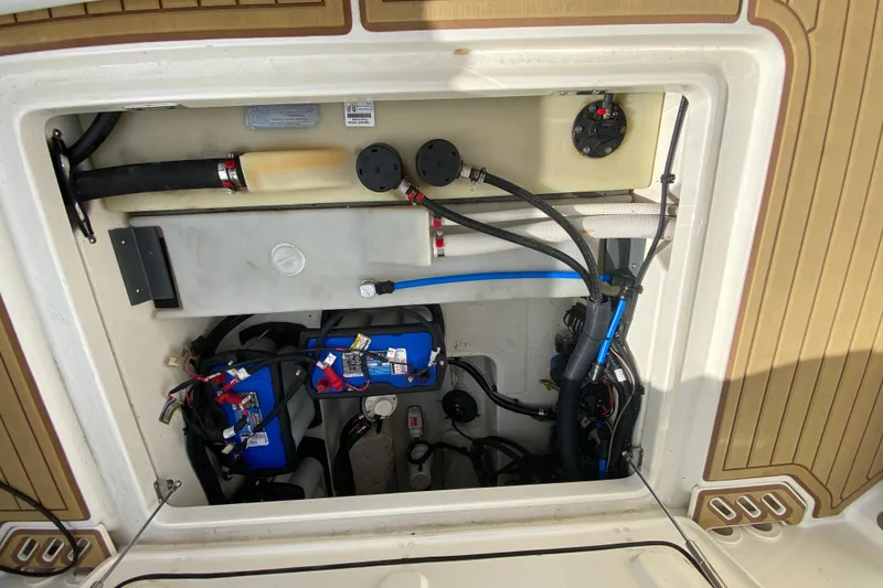 Slide: The Image of 2019 Boston Whaler 270 Vantage engine compartment with wiring and components visible. - 45