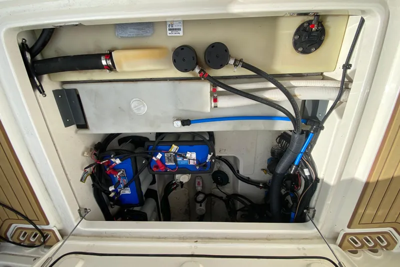 Slide: The Image of 2019 Boston Whaler 270 Vantage engine compartment with wiring and components visible. - 46