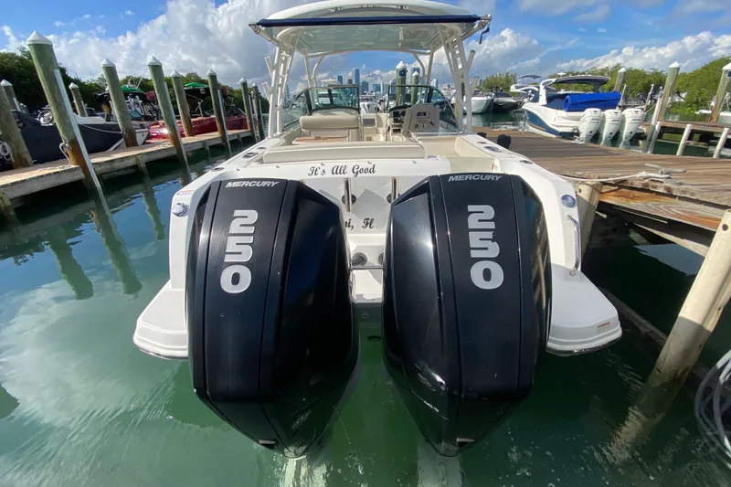 Slide: The Image of 2019 Boston Whaler 270 Vantage with twin Mercury 250 engines docked at marina. - 49