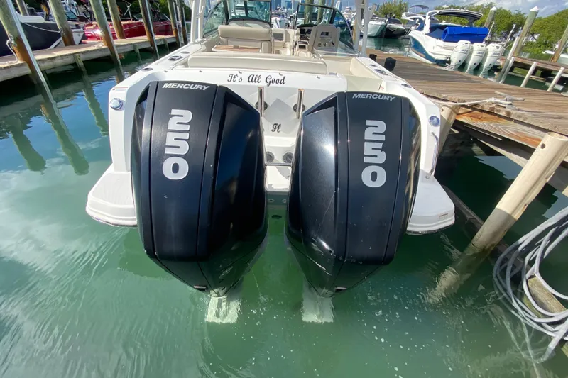 Slide: The Image of 2019 Boston Whaler 270 Vantage with twin Mercury 250 engines docked in marina. - 50