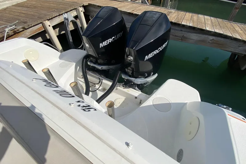 Slide: The Image of 2019 Boston Whaler 270 Vantage with dual Mercury outboard engines docked. - 51