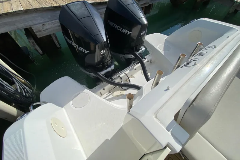 Slide: The Image of 2019 Boston Whaler 270 Vantage with dual Mercury outboard engines at dock. - 52