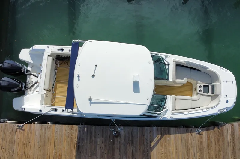 Slide: The Image of Overhead view of 2019 Boston Whaler 270 Vantage docked, showcasing spacious seating and dual engines. - 57