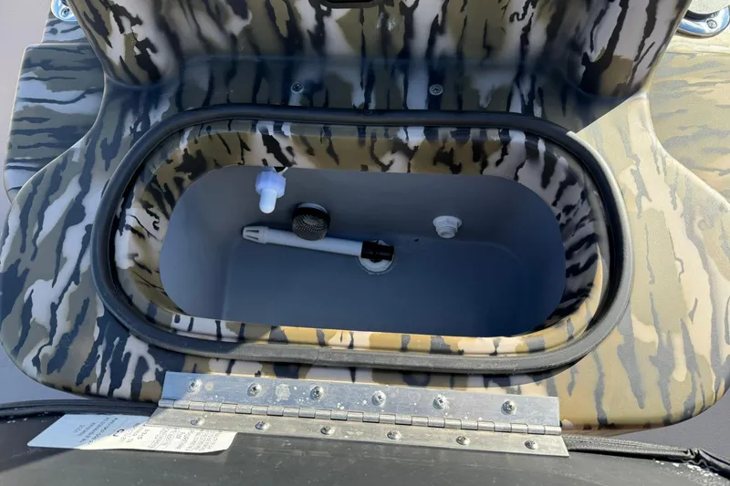 Slide: The Image of Camouflage interior of 2026 Avid 20 ROGUE CC boat compartment. - 15