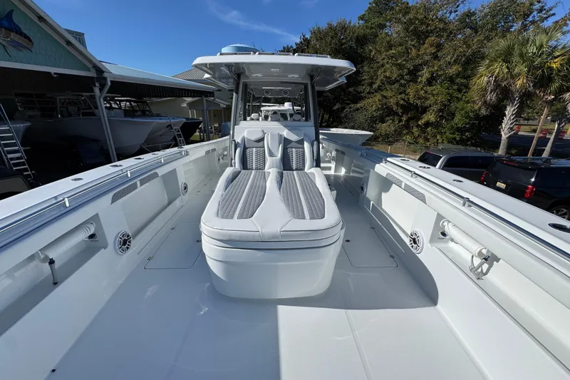 Slide: The Image of 2026 Invincible 46 Catamaran with sleek deck design and modern seating. - 21