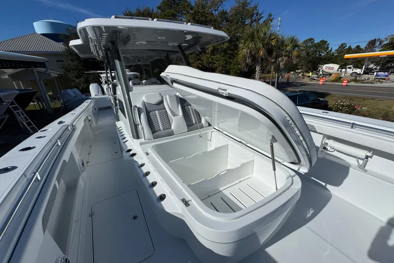 Slide: The Image of 2026 Invincible 46 Catamaran with open storage compartment, sleek design, and modern features. - 22