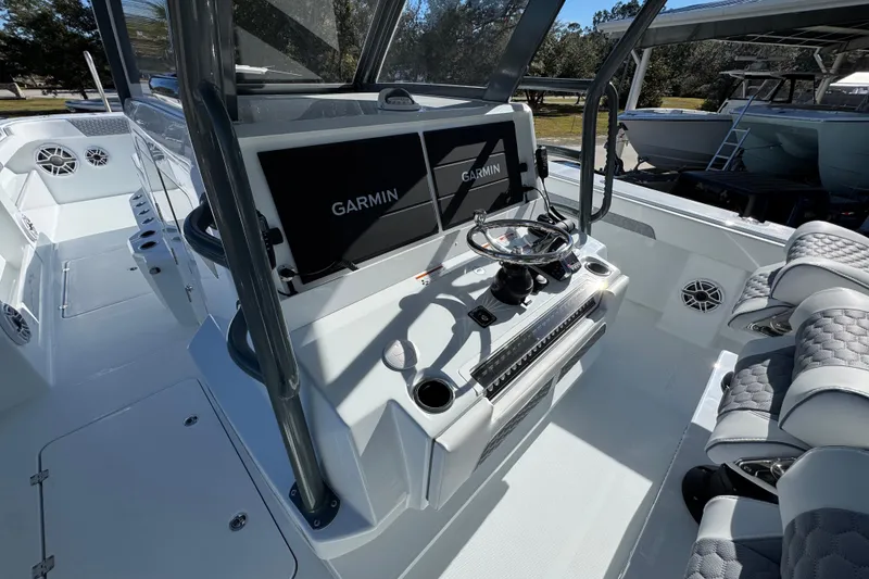 Slide: The Image of 2026 Invincible 46 Catamaran cockpit with Garmin navigation, luxurious seating, and modern controls. - 34