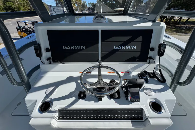 Slide: The Image of Cockpit of 2026 Invincible 46 Catamaran with Garmin navigation displays and steering wheel. - 35