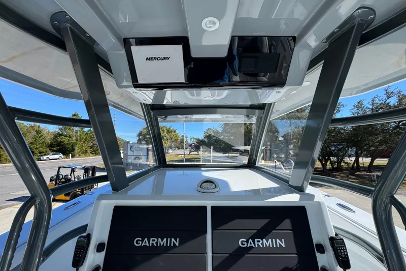 Slide: The Image of Interior view of 2026 Invincible 46 Catamaran with Garmin navigation displays and Mercury equipment. - 36