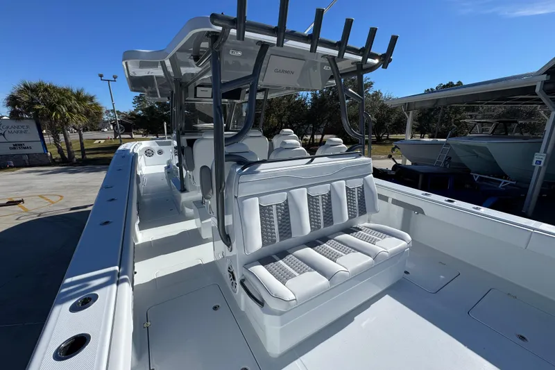 Slide: The Image of 2026 Invincible 46 Catamaran with sleek seating and modern design in a marina setting. - 42