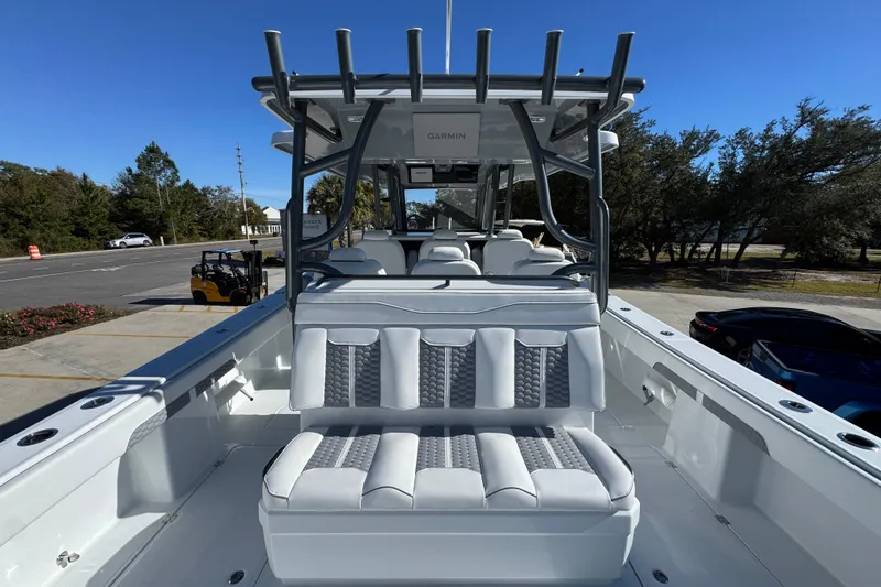 Slide: The Image of 2026 Invincible 46 Catamaran with sleek seating and modern design, parked outdoors. - 43