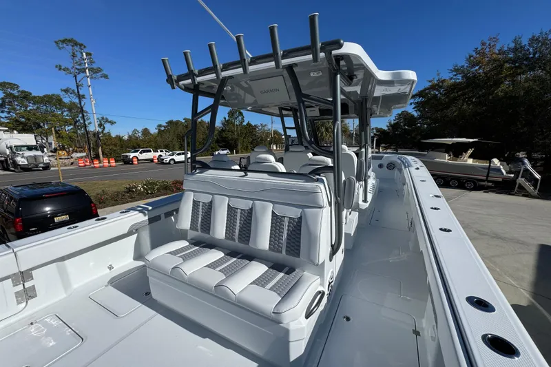 Slide: The Image of 2026 Invincible 46 Catamaran with sleek seating and modern design in a marina setting. - 44