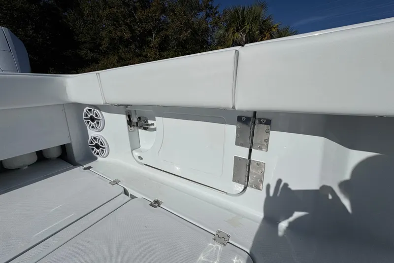 Slide: The Image of 2026 Invincible 46 Catamaran interior with speakers and storage compartment. - 47